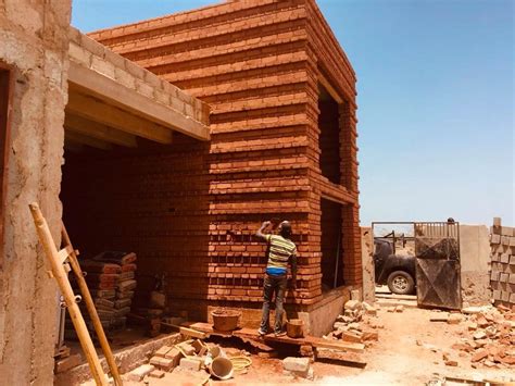 mudding gun Senegal|In practice: Worofila on earth block construction in Senegal.